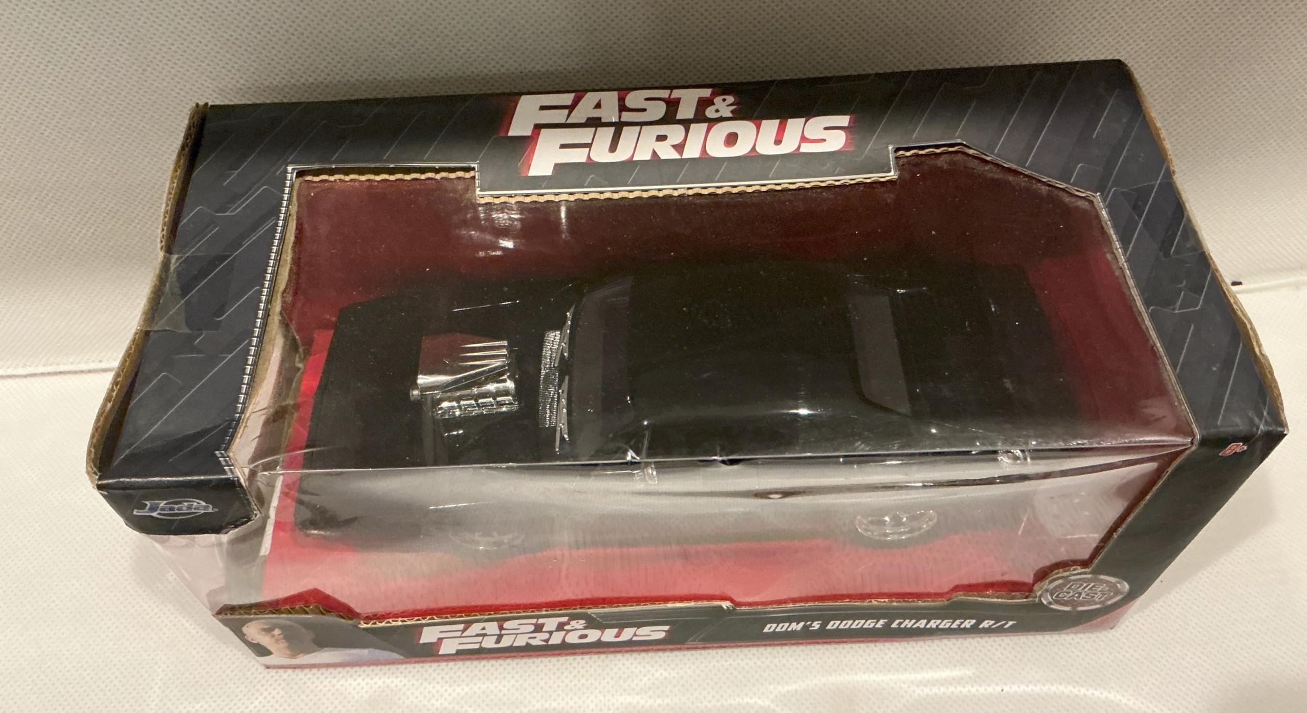 Jada Toys Furious 7 1970 Dodge Charger – 1:24 Scale Die-cast Vehicle – Opening Doors, Hood, Trunk – Rubber Tires – Ages 8+ – Glossy Black
