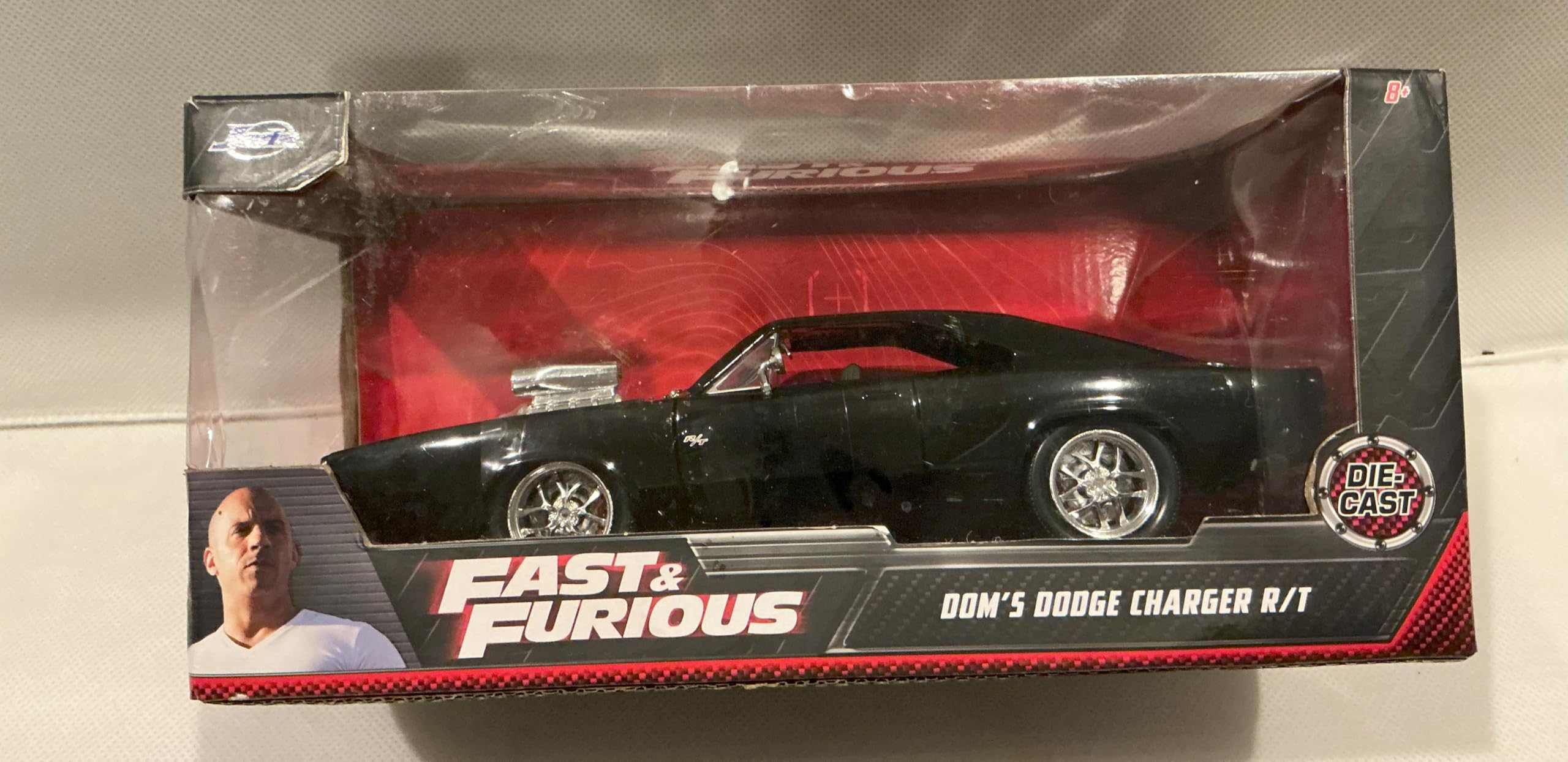 Jada Toys Furious 7 1970 Dodge Charger – 1:24 Scale Die-cast Vehicle – Opening Doors, Hood, Trunk – Rubber Tires – Ages 8+ – Glossy Black